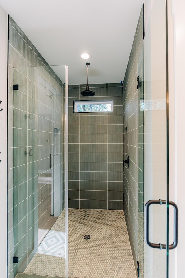 bathroom featuring a shower stall