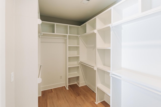 walk in closet featuring visible vents and light wood-style floors