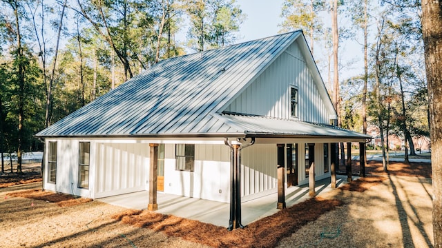 view of property exterior featuring metal roof and a standing seam roof