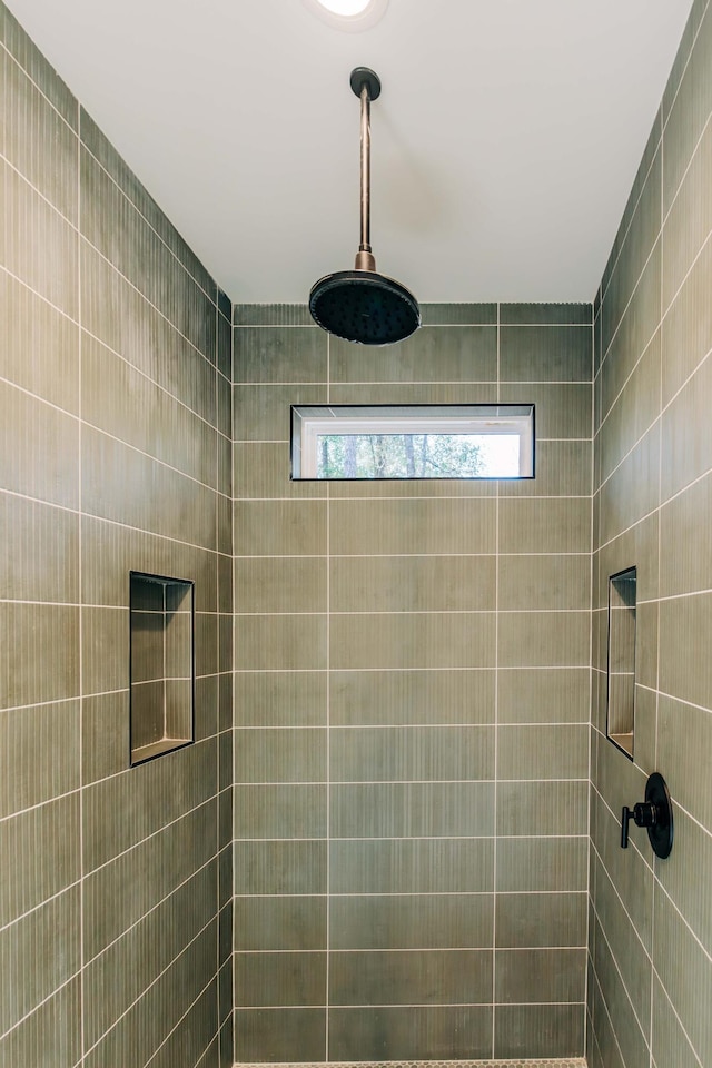 full bathroom with a tile shower