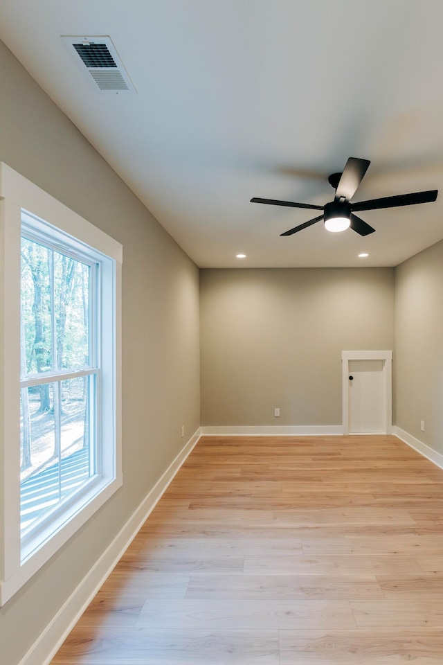 spare room with visible vents, baseboards, recessed lighting, light wood-style floors, and a ceiling fan