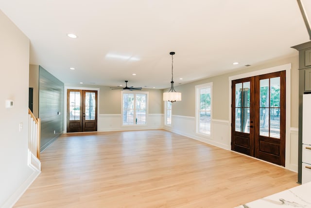 foyer with ceiling fan, a wainscoted wall, light wood-type flooring, recessed lighting, and french doors