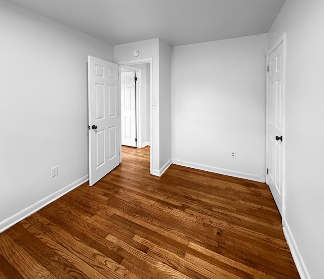 1481 Woodview Ln, Charleston, SC 29412 - unfurnished bedroom featuring baseboards and dark wood finished floors
