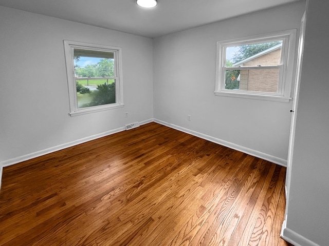 1481 Woodview Ln, Charleston, SC 29412 - empty room with plenty of natural light and wood finished floors