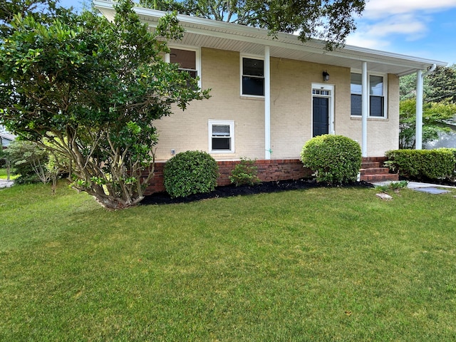1481 Woodview Ln, Charleston, SC 29412 - view of front of property with a front yard, brick siding, and covered porch