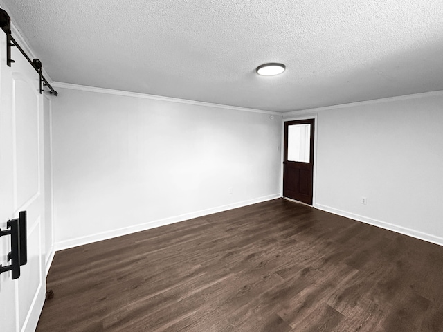 1481 Woodview Ln, Charleston, SC 29412 - unfurnished room featuring a textured ceiling, dark wood-style floors, a barn door, and ornamental molding
