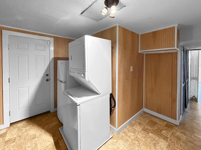 1481 Woodview Ln, Charleston, SC 29412 - laundry room with estacked washer and dryer and a textured ceiling