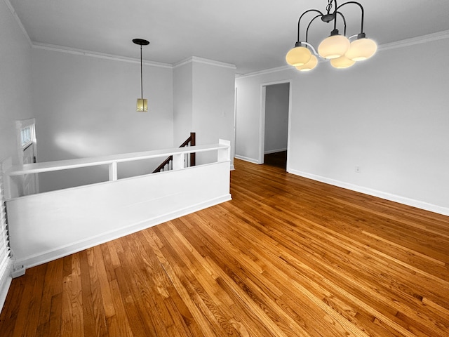 1481 Woodview Ln, Charleston, SC 29412 - spare room with a chandelier, wood finished floors, and crown molding