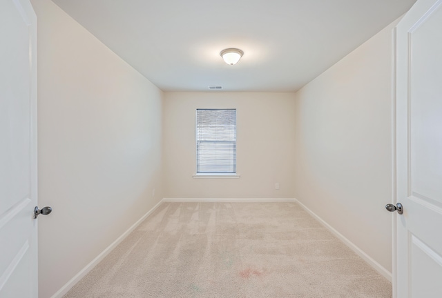 spare room with light colored carpet