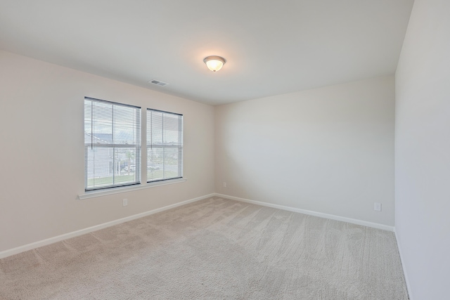 empty room with carpet flooring