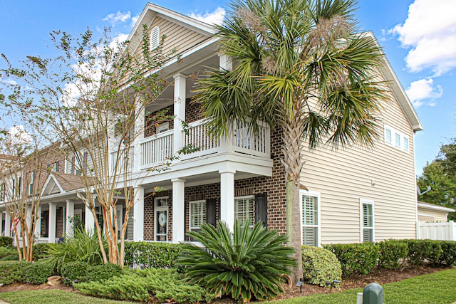 view of home's exterior with a balcony