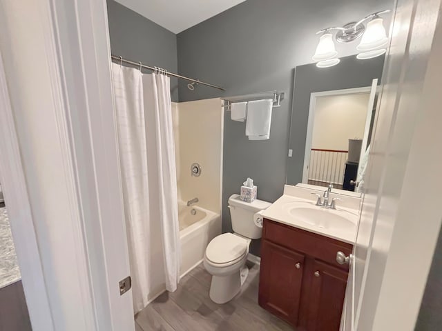 full bathroom with toilet, vanity, hardwood / wood-style flooring, and shower / bathtub combination with curtain