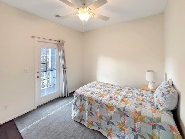 bedroom with access to exterior, hardwood / wood-style floors, and ceiling fan