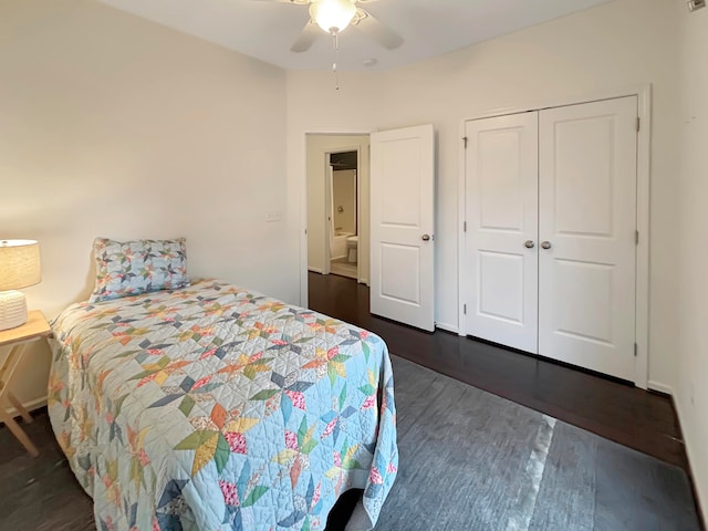 bedroom with dark hardwood / wood-style flooring, ceiling fan, and a closet