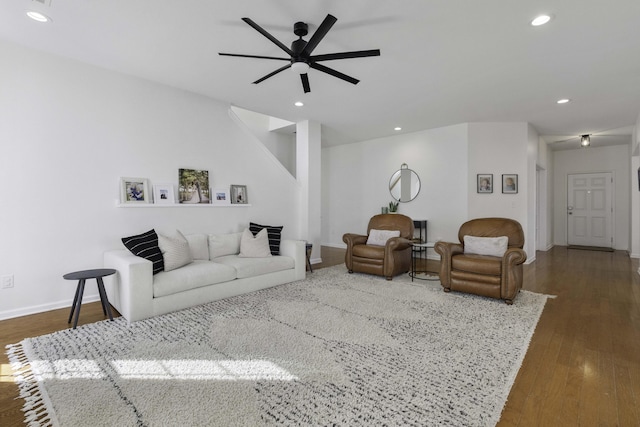 living room with baseboards, a ceiling fan, dark wood-style flooring, and recessed lighting