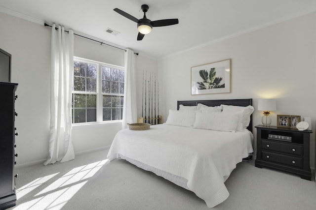 bedroom featuring visible vents, baseboards, ceiling fan, ornamental molding, and carpet