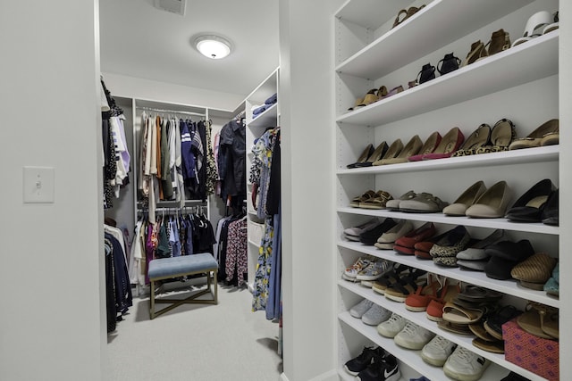 walk in closet featuring carpet floors and visible vents