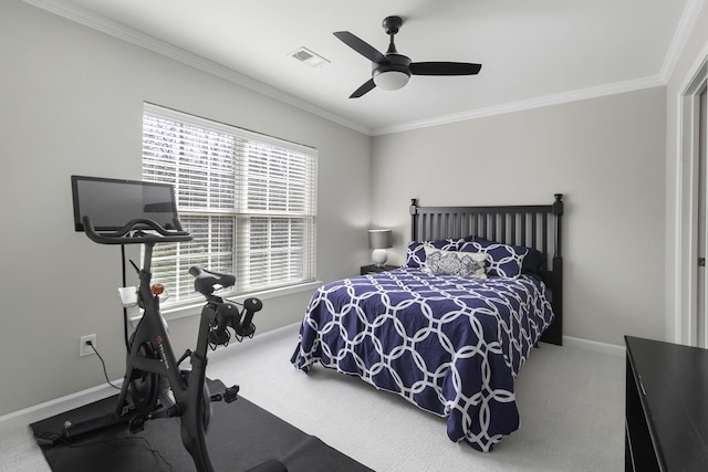 bedroom featuring baseboards, carpet, visible vents, and crown molding