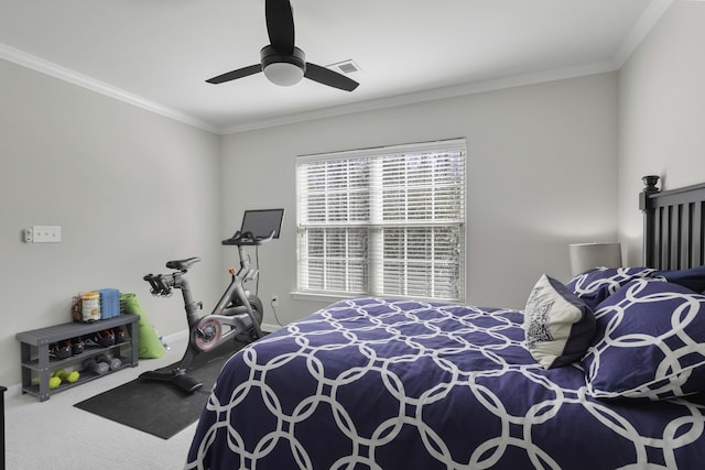 carpeted bedroom with ornamental molding, a ceiling fan, visible vents, and baseboards