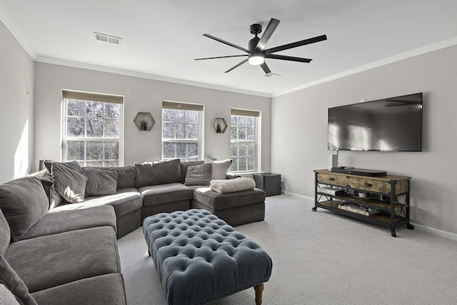 living area featuring crown molding, baseboards, and carpet flooring