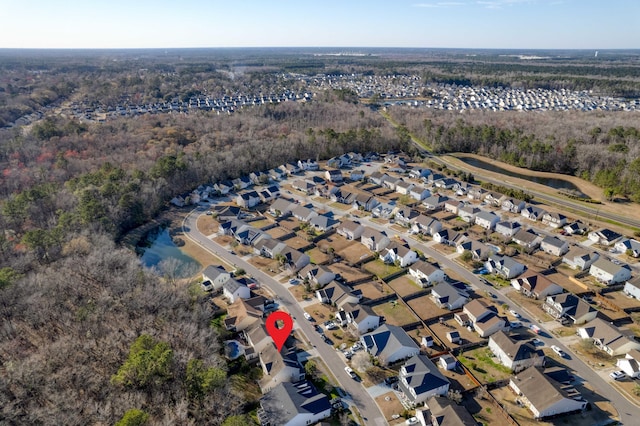 birds eye view of property with a residential view