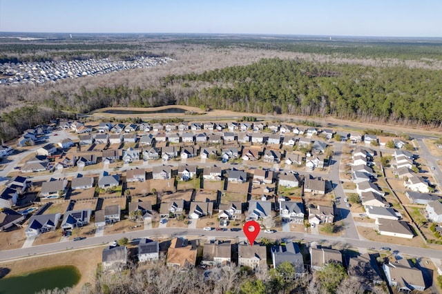 bird's eye view with a forest view and a residential view