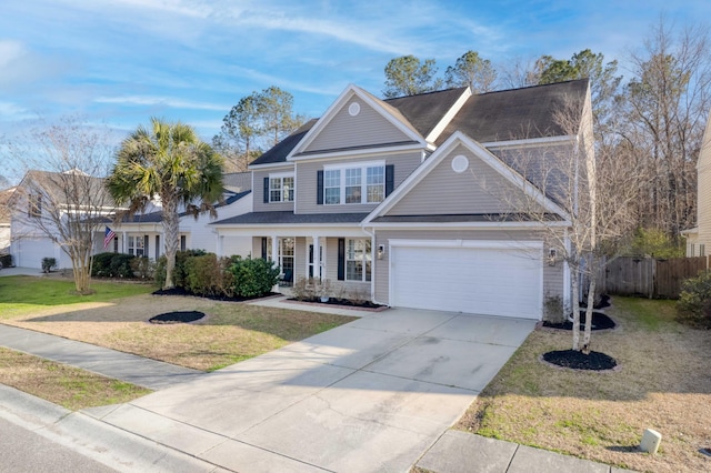 view of front of home featuring a garage, covered porch, fence, driveway, and a front lawn