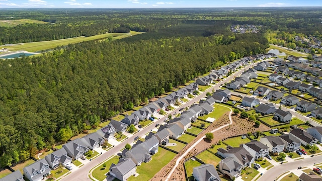 aerial view with a residential view and a view of trees