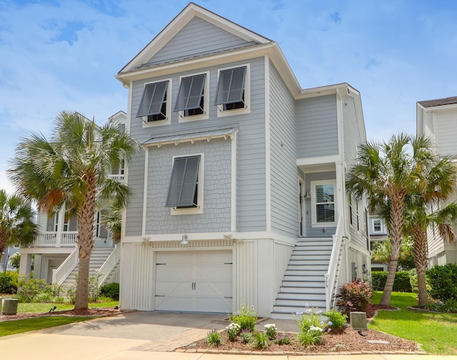 779 Forrest Dr, Charleston, SC 29492 - raised beach house with stairs, a garage, and concrete driveway