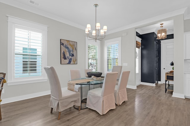 779 Forrest Dr, Charleston, SC 29492 - dining room with a chandelier, wood finished floors, baseboards, and ornamental molding