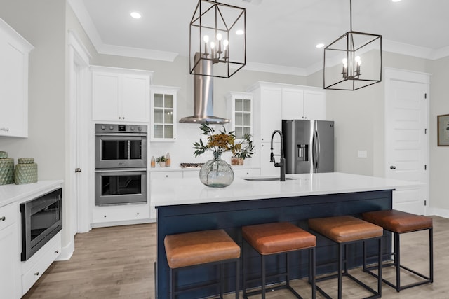 779 Forrest Dr, Charleston, SC 29492 - kitchen with appliances with stainless steel finishes, a chandelier, wall chimney exhaust hood, a sink, and light countertops