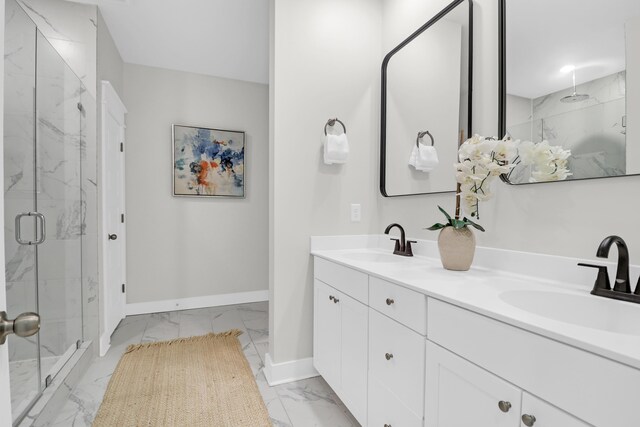 779 Forrest Dr, Charleston, SC 29492 - bathroom featuring marble look tiles, baseboards, a marble finish shower, and double vanity