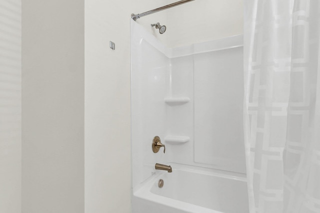 full bathroom featuring shower / bathtub combination with curtain