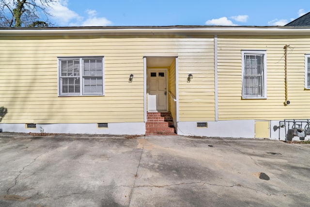 doorway to property featuring crawl space