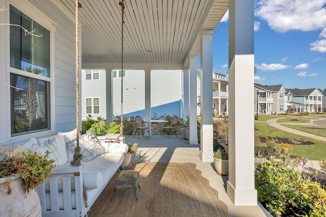 view of patio / terrace featuring a residential view and a porch