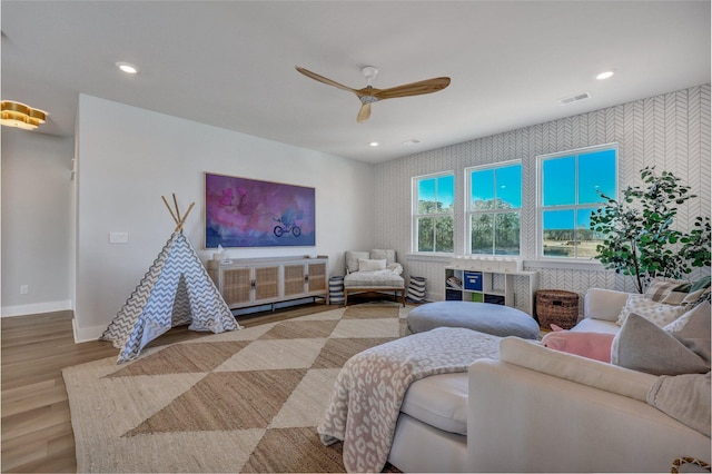 interior space with visible vents, wood finished floors, recessed lighting, baseboards, and ceiling fan