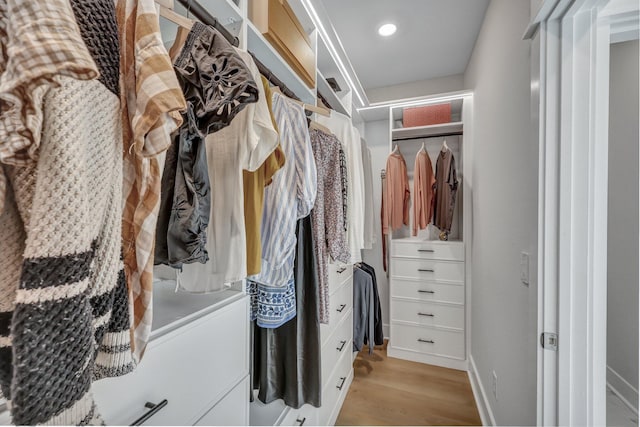 walk in closet featuring light wood-style floors