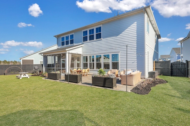 back of property with a yard, an outdoor hangout area, and a fenced backyard