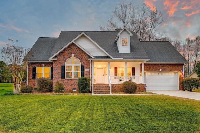 view of front of house with crawl space, a lawn, concrete driveway, and brick siding