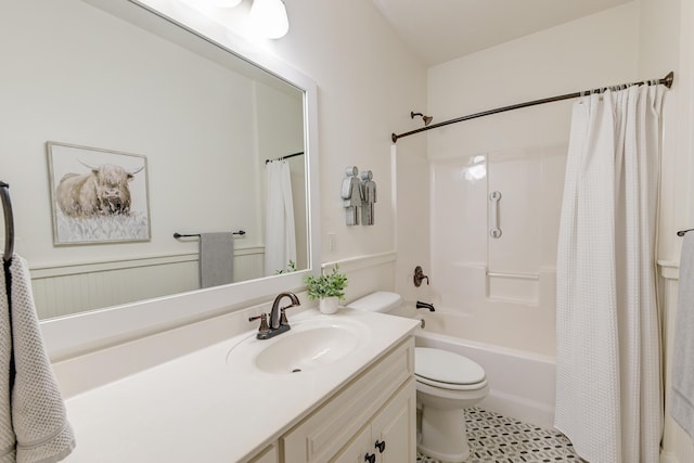 bathroom with toilet, shower / bathtub combination with curtain, and vanity