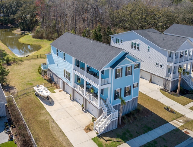 birds eye view of property with a water view