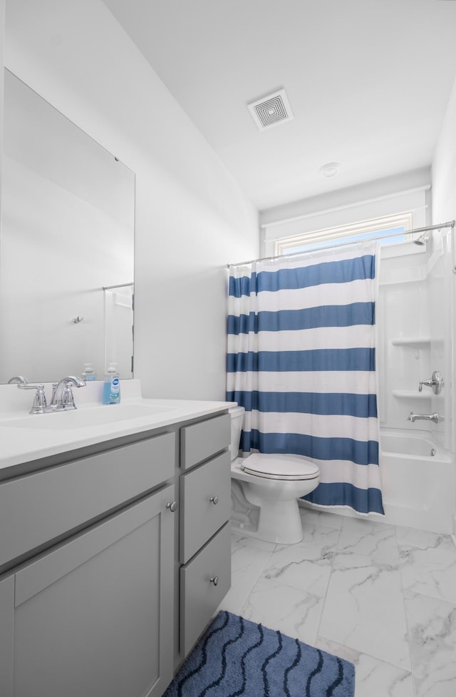 full bath featuring visible vents, toilet, shower / bath combo, marble finish floor, and vanity