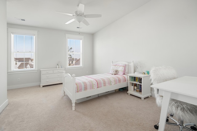 bedroom with a ceiling fan, baseboards, visible vents, and light carpet