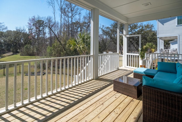 wooden terrace featuring an outdoor living space