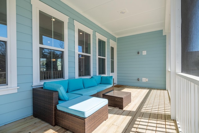 wooden terrace with covered porch and outdoor lounge area