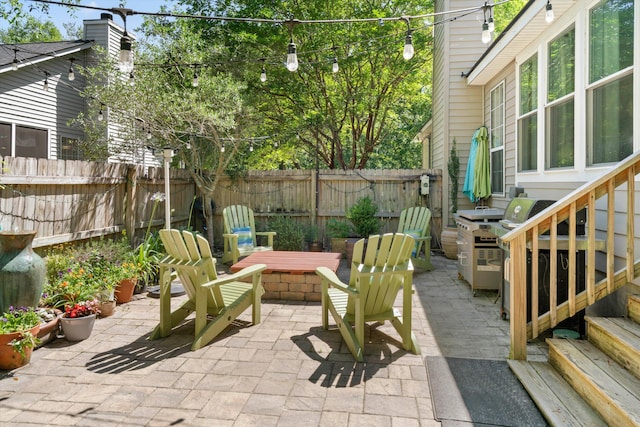1227 Ocean View Rd, Charleston, SC 29412 - fenced backyard featuring an outdoor fire pit, a patio area, and grilling area