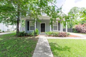 view of front of home featuring a front yard and a porch