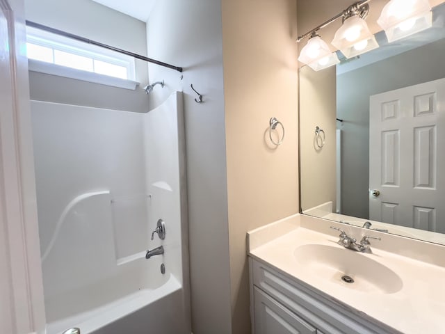 full bath featuring washtub / shower combination and vanity