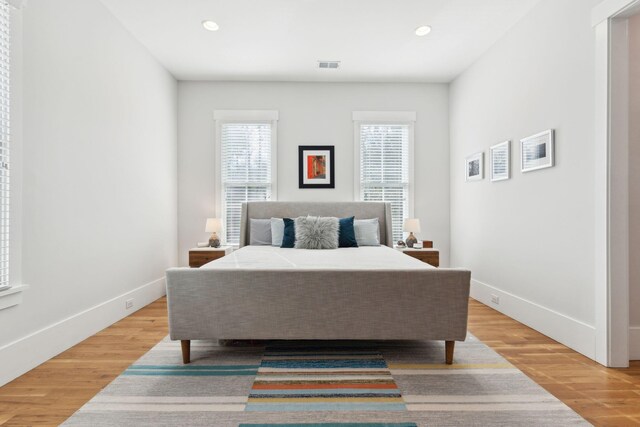 bedroom with light hardwood / wood-style flooring