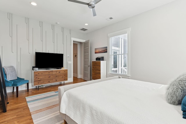 bedroom featuring light hardwood / wood-style flooring and ceiling fan